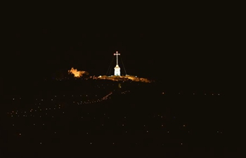 People take part in Maundy Thursday services in Siggiewi, Malta