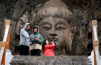 In pics: snow-covered Longmen Grottoes in Luoyang, C China's Henan